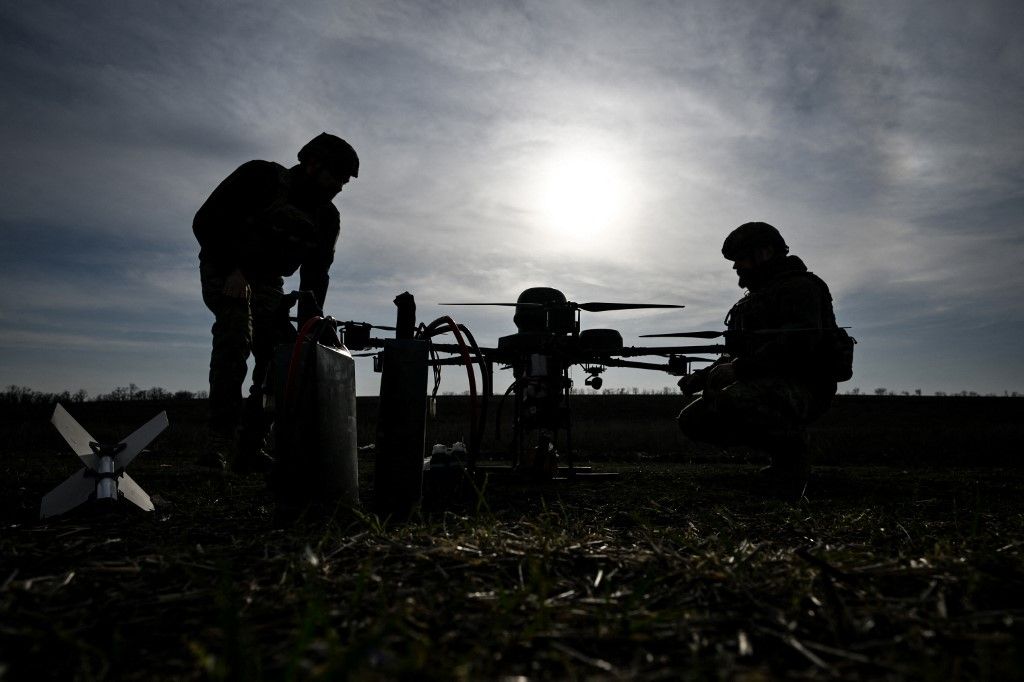Soldiers from a drone unit of a battalion of Ukraine's 422nd Separate Unmanned Systems Regiment ''Luftwaffe'' prepare a Baba Yaga heavy bomber drone before a daytime training flight in the Zaporizhzhia direction, Ukraine, on March 23, 2026. (Photo by Dmytro Smolienko/Ukrinform/NurPhoto) (Photo by Dmytro Smolienko / NurPhoto via AFP)