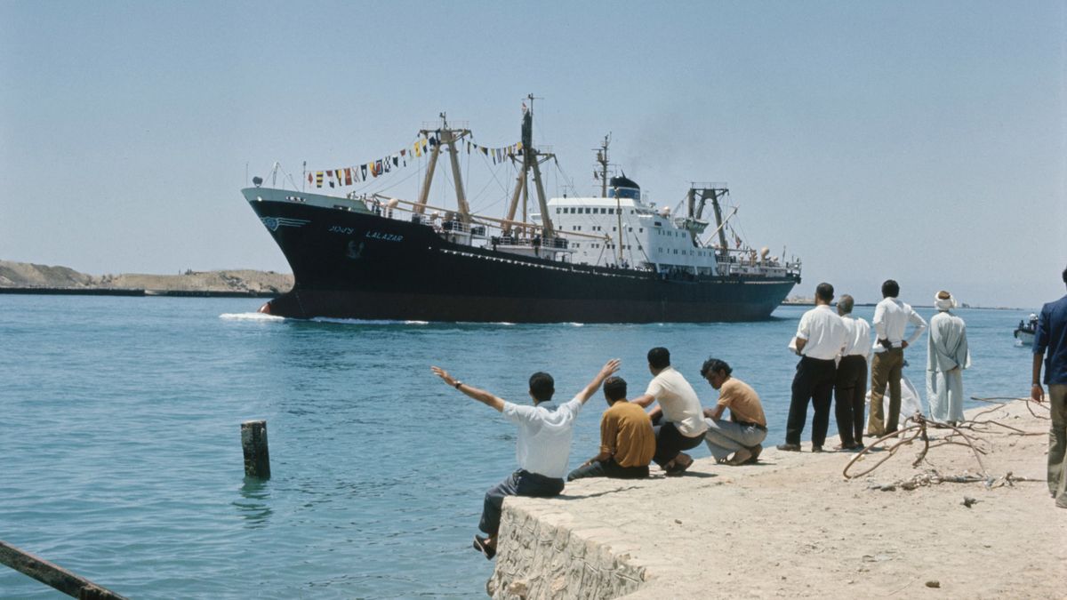 Lugas
A freighter makes its way northward along the Suez Canal in Egypt on June 6th, 1975. The ship is part of the first commercial convoy to use the canal following its reopening after the Arab-Israeli war. (Photo by UPI/Bettmann Archive/Getty Images)