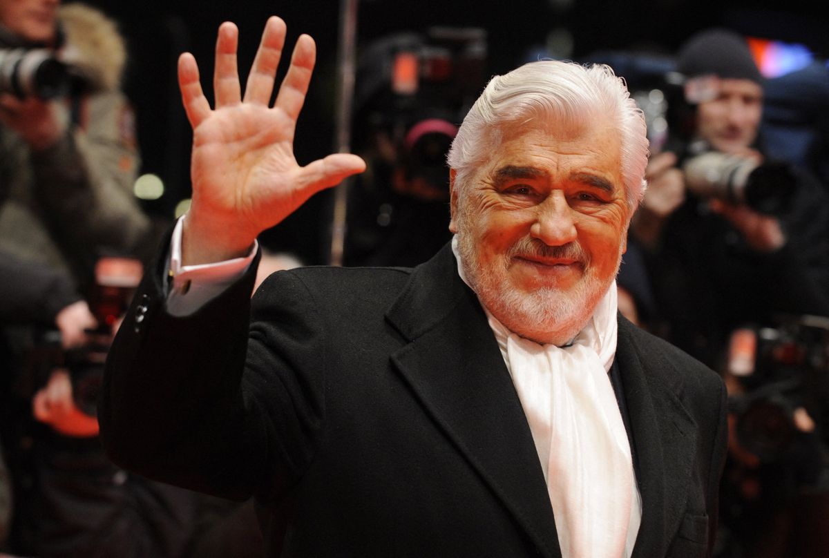 (FILES) German actor Mario Adorf waves as he arrives for the premiere of the film "Apart Together" competing in the 60th Berlinale Film Festival in Berlin February 11, 2010. Actor Mario Adorf has died at the age of 95 on April 8, 2026, his longtime manager Michael Stark announced on April 9, 2026. He passed away in his sleep in his apartment in Paris on Wednesday after a short illness, he said. (Photo by John MACDOUGALL / AFP)