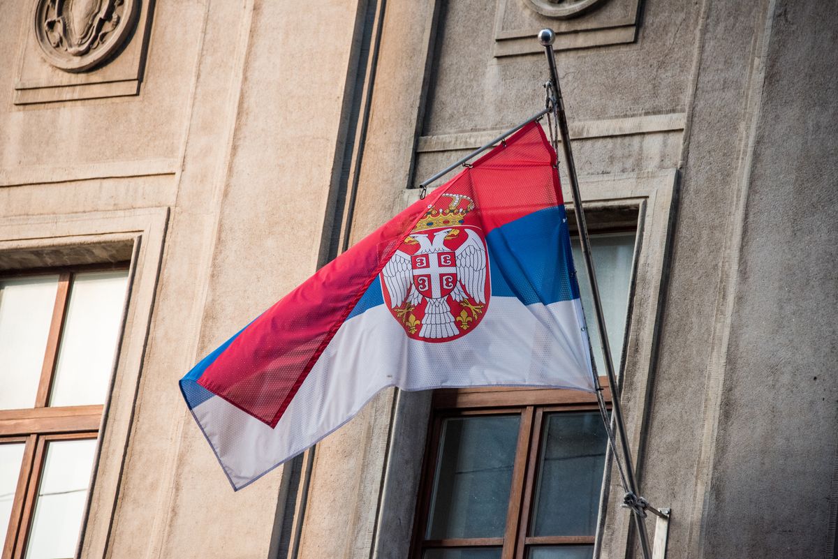 Low angle view of a Serbian flag on a building in Belgrade