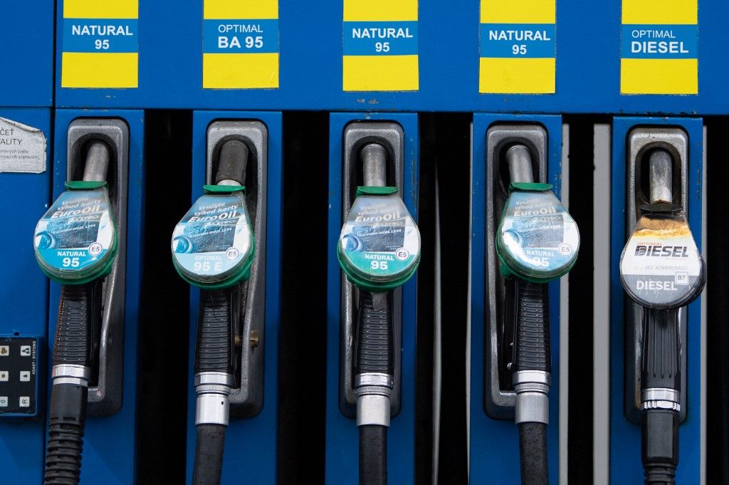 19 October 2021, Czech Republic, Hrensko: Faucets hang from a fuel pump at a gas station on the German-Czech border. In Germany, diesel is now more expensive than ever before. Photo: Sebastian Kahnert/dpa-Zentralbild/dpa (Photo by Sebastian Kahnert / dpa-Zentralbild / dpa Picture-Alliance via AFP)