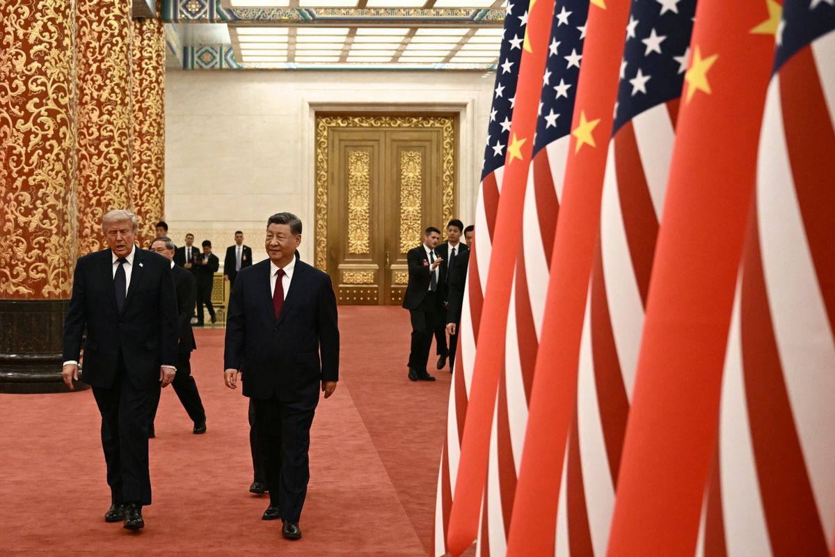 China's President Xi Jinping (R) and US President Donald Trump arrive to attend a state banquet at the Great Hall of the People in Beijing on May 14, 2026. (Photo by Brendan SMIALOWSKI / AFP)