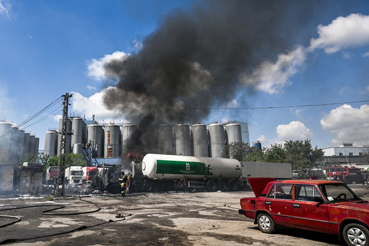 Tank trucks used by a private company to supply petrol station chains are damaged in Zaporizhzhia, Ukraine, on May 15, 2026. A drone strike on an industrial facility results in damage to a fuel cistern and causes tank trucks to catch fire. One civilian employee, a driver, is killed, and three other company employees sustain serious injuries in the explosion. (Photo by Dmytro Smolienko/Ukrinform/NurPhoto) (Photo by Dmytro Smolienko / NurPhoto via AFP)