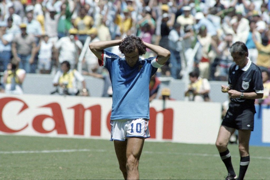 French player Michel Platini reacts as referee gives a yellow card during the World Cup football match between France and Brazil, on June 21, 1986 in Guadalajara. (Photo by AFP)