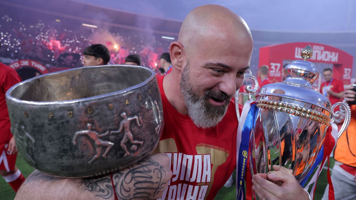 Abu Fani
FK Crvena Zvezda (Red Star) coach Dejan Stankovic celebrates with the Serbian SuperLiga and Serbian Cup trophies at the Rajko Mitic Stadium in Belgrade on May 22, 2026, before their SuperLiga match against OFK Belgrade. (Photo by Pedja Milosavlje