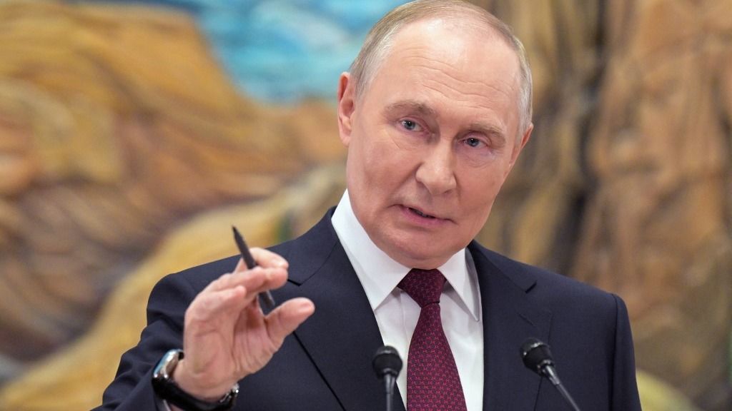 In this pool photograph distributed by the Russian state agency Sputnik, Russia's President Vladimir Putin meets with the Russian media in Bishkek on November 27, 2025. (Photo by Alexey NIKOLSKY / POOL / AFP)