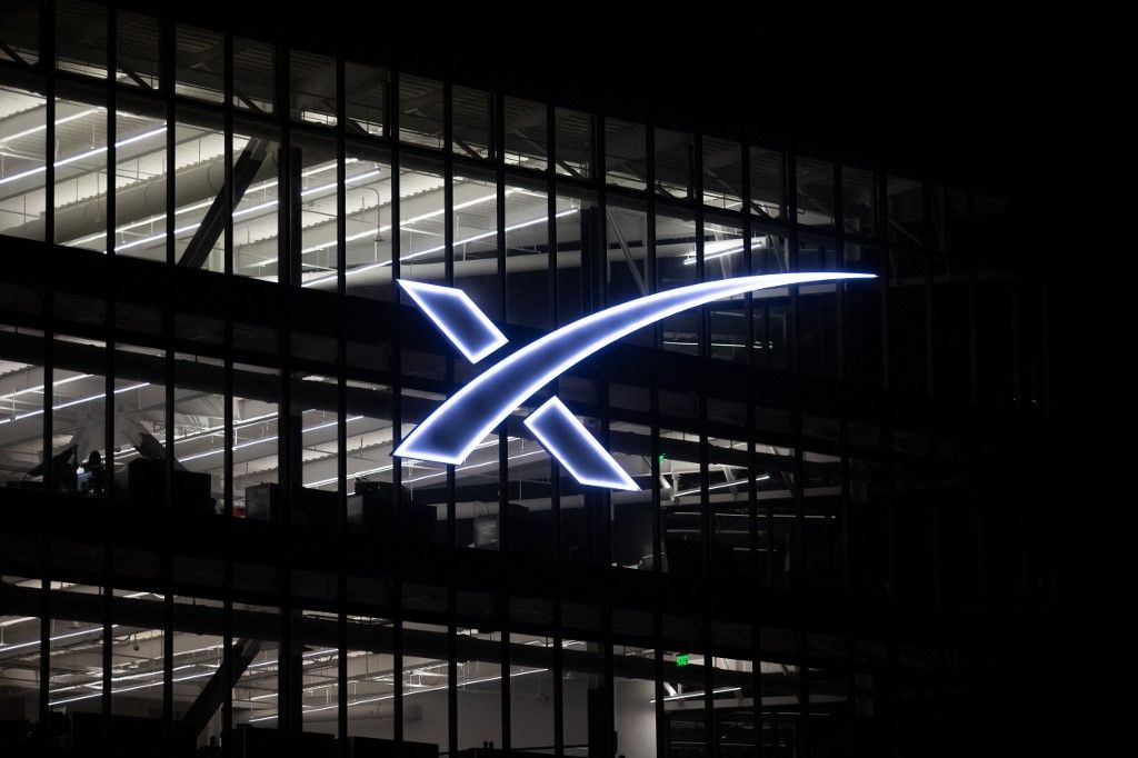 The SpaceX logo is visible at the company's South Texas production facility in Cameron County, Texas, on April 12, 2026. (Photo by Reginald Mathalone/NurPhoto) (Photo by Reginald Mathalone / NurPhoto via AFP)