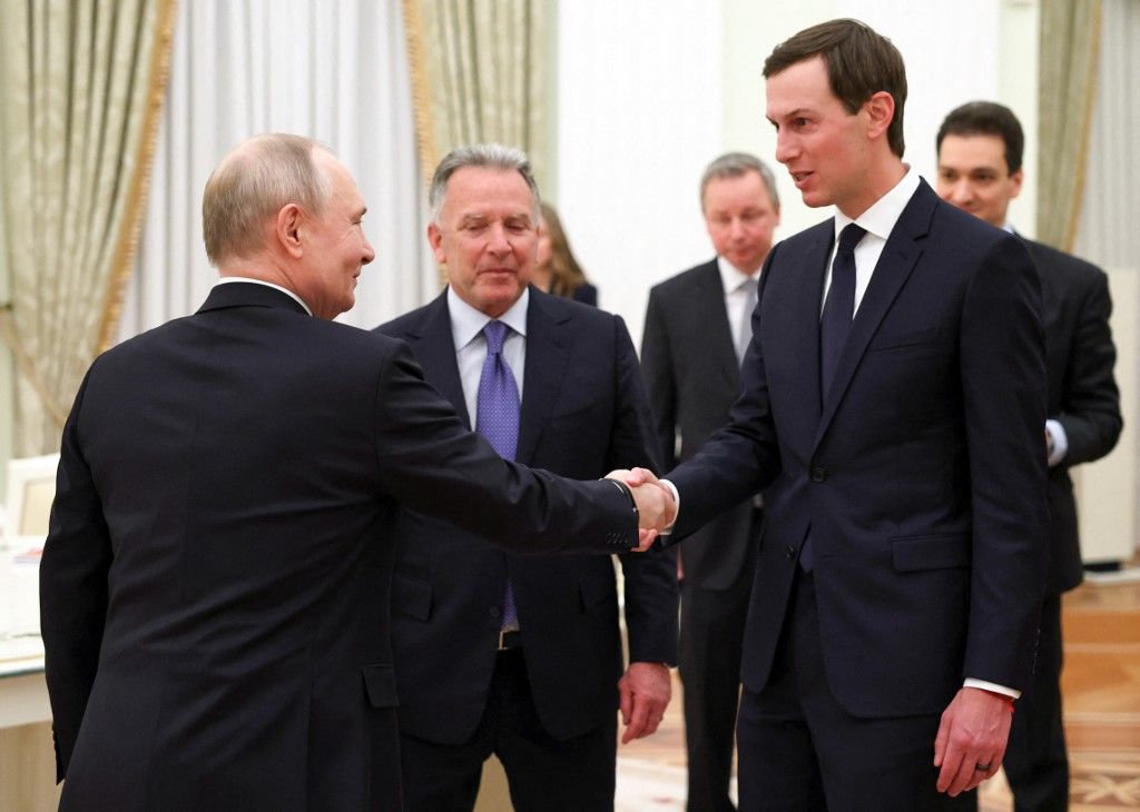 In this pool photograph distributed by the Russian state agency Sputnik, Russia's President Vladimir Putin welcomes US special envoy Steve Witkoff and US President Donald Trump's son-in-law Jared Kushner during a meeting at the Kremlin in Moscow on January 22, 2026. (Photo by Alexander KAZAKOV / POOL / AFP)