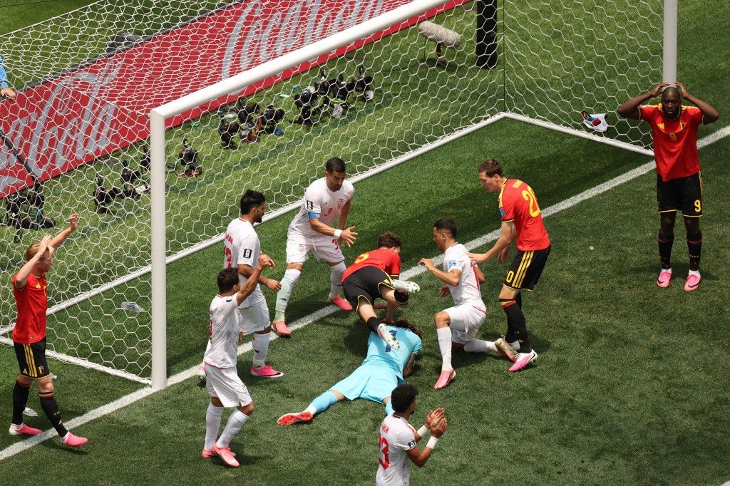 Iran's goalkeeper #01 Alireza Beiranvand makes a save past Belgium's defender #05 Maxim De Cuyper during the 2026 World Cup Group G football match between Belgium and Iran at the Los Angeles Stadium in Inglewood on June 21, 2026. (Photo by Etienne Laurent / AFP)