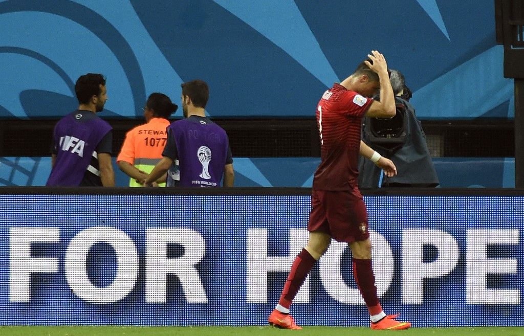 Portugal's forward Cristiano Ronaldo reacts during a Group G football match between USA and Portugal at the Amazonia Arena in Manaus during the 2014 FIFA World Cup on June 22, 2014.  AFP PHOTO / ODD ANDERSEN (Photo by ODD ANDERSEN / AFP)