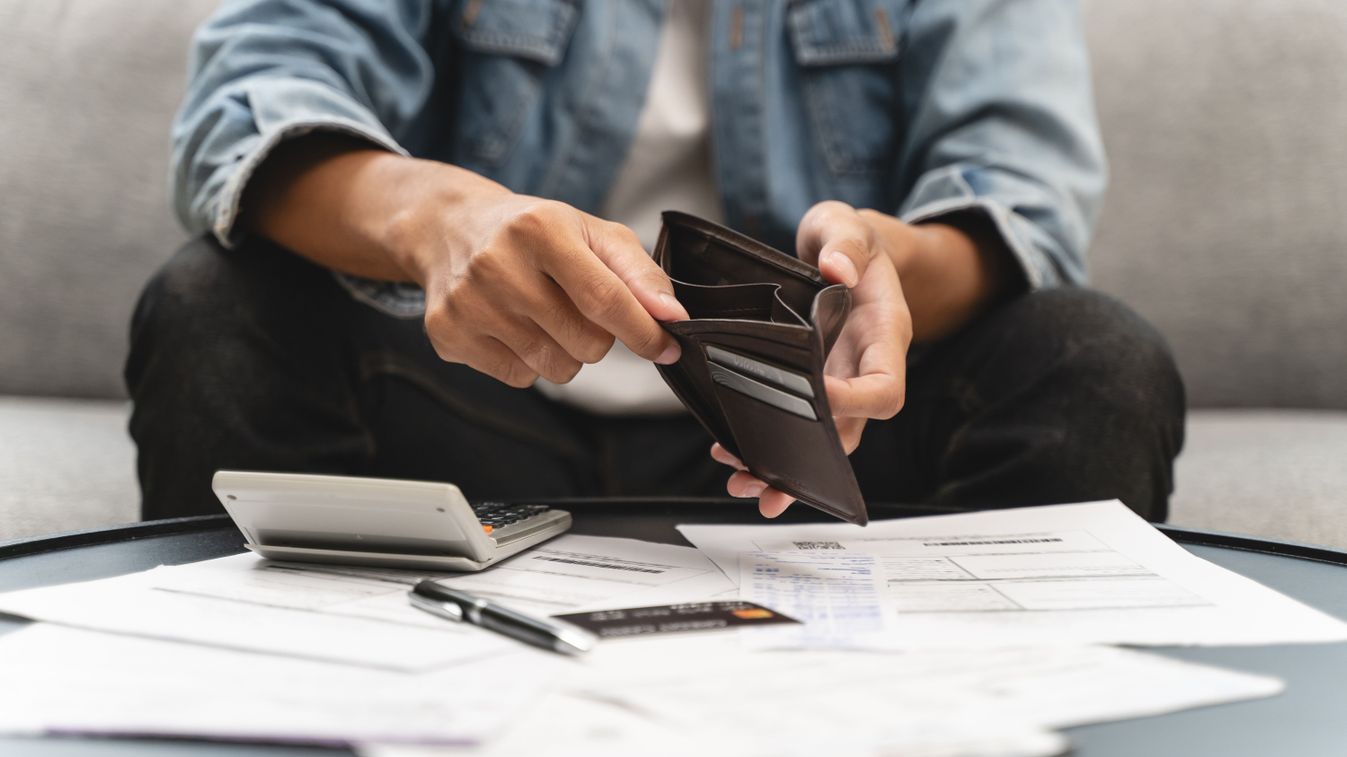 Bankruptcy problem financial concept, Young man opening empty wallet stress to find money to pay debt mortgage  period.

2716363533
Shutterstock
Pormezz