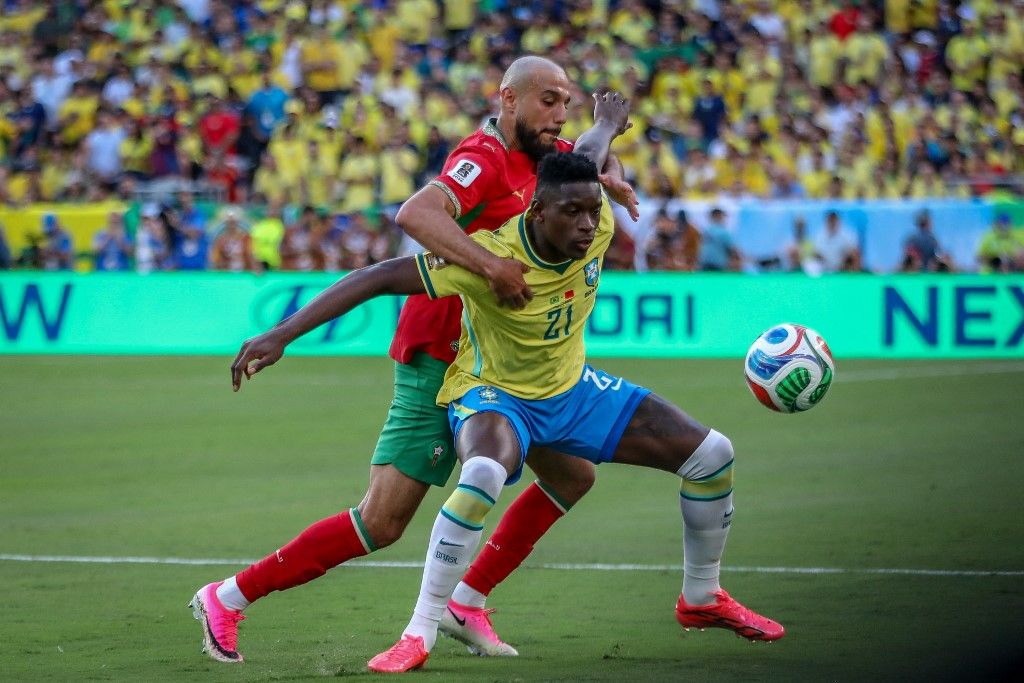 Luiz Henrique of Brazil battles for possession with Noussair Mazraoui of Morocco during the FIFA World Cup USA 2026 Group C match between Brazil and Morocco at New York, New Jersey Stadium, United States, on June 13, 2026. (Photo by Ayman Aref/NurPhoto) (Photo by Ayman Aref / NurPhoto via AFP)