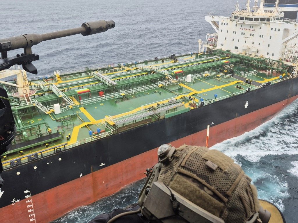 This handout photograph made available on June 1, 2026 by the French Marine Nationale (French Navy) shows military personnel hovering in a helicopter above the Tagor, a sanctioned Russian oil tanker, some 400 nautical miles west of France's Brittany coast. France and its allies have detained a sanctioned Russian oil tanker in the Atlantic over the weekend, President Emmanuel Macron said on Monday. The Tagor was detained on Sunday morning in international waters with the help of Britain and other partners, he said in a social media post. (Photo by Handout / Marine Nationale / AFP) / RESTRICTED TO EDITORIAL USE - MANDATORY CREDIT "AFP PHOTO / MARINE NATIONALE " - HANDOUT - NO MARKETING NO ADVERTISING CAMPAIGNS - DISTRIBUTED AS A SERVICE TO CLIENTS