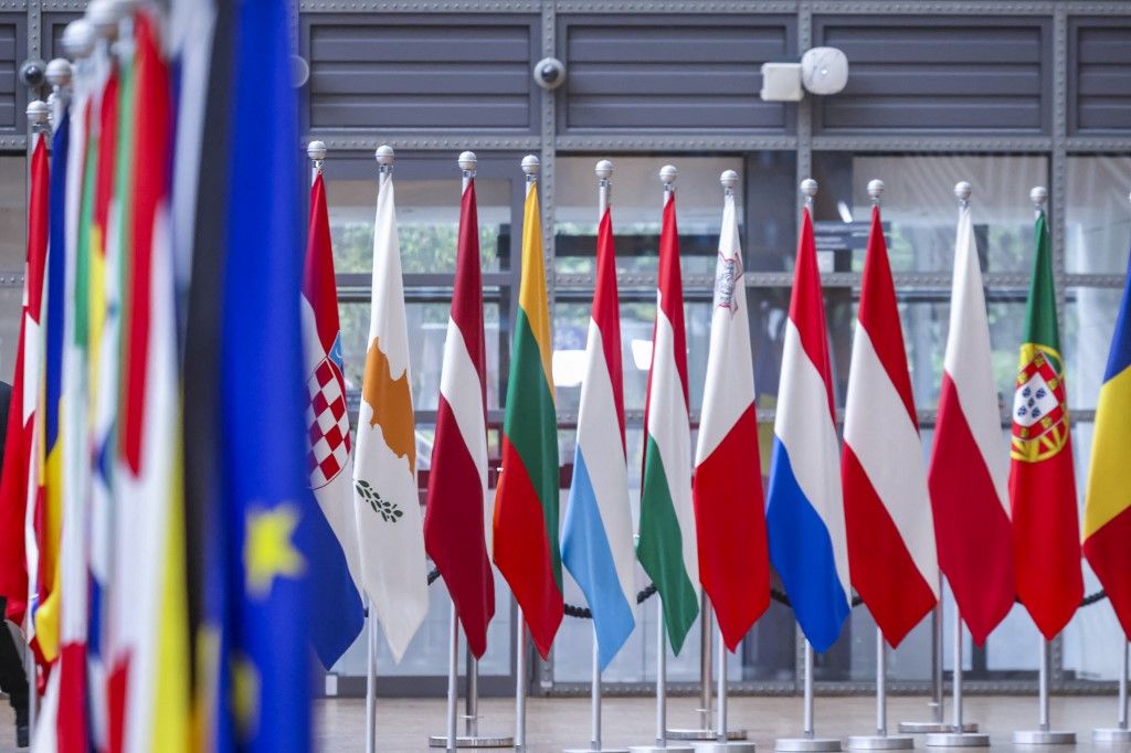 EU flags side by side from countries member states and the flag of Europe on poles in Europa Building next to the "Lantern" structure located inside the Europa Building the place where the European leaders and head of states, ministers and officials have their meetings frequently like the European Council summit. European Union Headquarters, Brussels, Belgium on May 11, 2026 (Photo by Nicolas Economou/NurPhoto) (Photo by Nicolas Economou / NurPhoto via AFP)