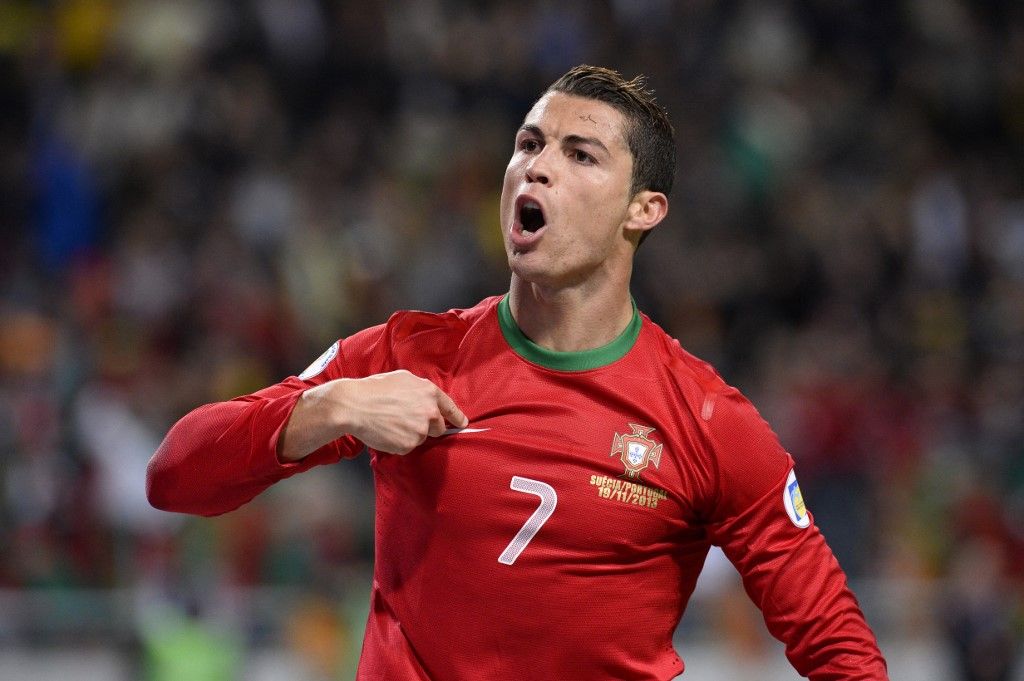 Portugal's forward Cristiano Ronaldo celebrates after scoring the second goal for Portugal during the FIFA 2014 World Cup playoff football match Sweden vs Portugal at the Friends Arena in Solna near Stockholm on November 19, 2013 . AFP PHOTO/ JONATHAN NACKSTRAND (Photo by Jonathan NACKSTRAND / AFP)