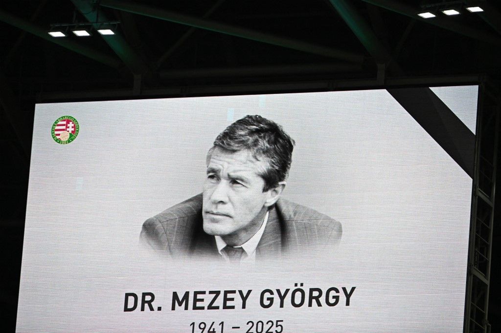 A picture of the late Hungarian football player and manager Gyorgy Mezey is on display prior to the FIFA World Cup 2026 Group F European qualification football match Hungary vs Armenia at the Puskas Arena in Budapest, Hungary on October 11, 2025. (Photo by Attila KISBENEDEK / AFP)
