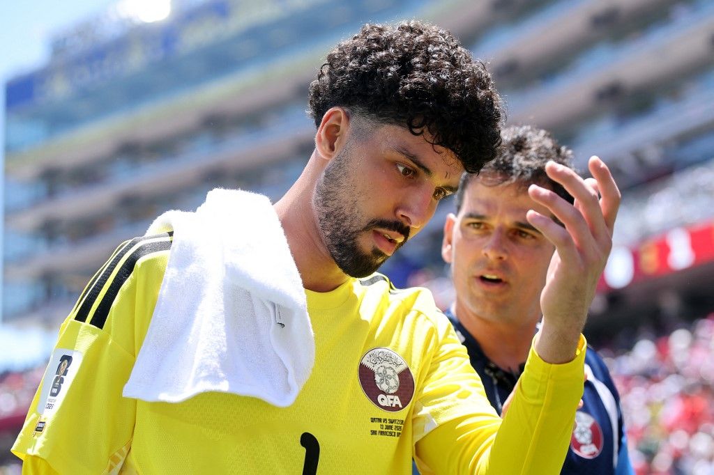 SANTA CLARA, CALIFORNIA - JUNE 13: Mahmoud Abunada #1 of Qatar reacts during the FIFA World Cup 2026 Group B match between Qatar and Switzerland at San Francisco Bay Area Stadium on June 13, 2026 in Santa Clara, California. Alex Grimm/Getty Images/AFP (Photo by ALEX GRIMM / GETTY IMAGES NORTH AMERICA / Getty Images via AFP)
