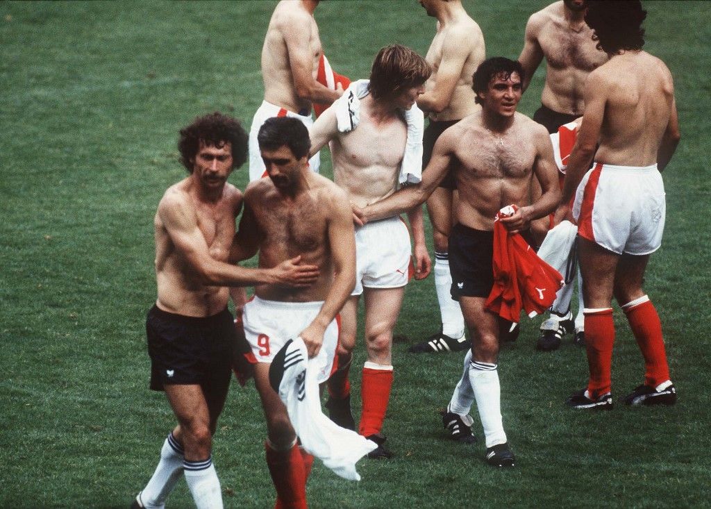 Hugging after the match during the 1982 FIFA World Cup in Spain. (Photo by SVEN SIMON / dpa Picture-Alliance via AFP)