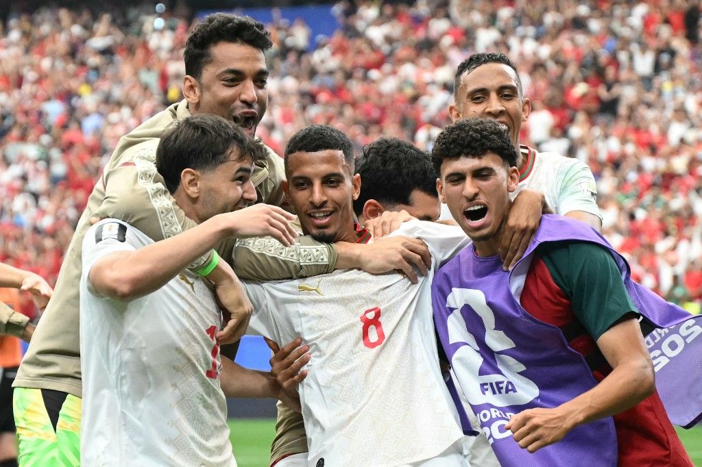 Morocco's midfielder #08 Azzedine Ounahi celebrates scoring his team's second goal with teammates during the 2026 World Cup round of 16 football match between Canada and Morocco at the Houston Stadium in Houston on July 4, 2026.  (Photo by RONALDO SCHEMIDT / AFP)