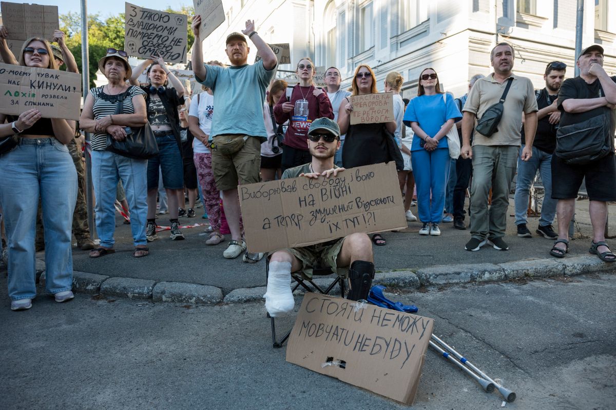 Ukrainians take part in a protest against President Volodymyr Zelenskyy's decision to remove Defence Minister Mykhailo Fedorov, in Kyiv, Ukraine, on July 17, 2026. Demonstrators also demand the dismissal of Commander-in-Chief of the Armed Forces of Ukraine Oleksandr Syrskyi. (Photo by Maxym Marusenko/NurPhoto) (Photo by Maxym Marusenko / NurPhoto via AFP)