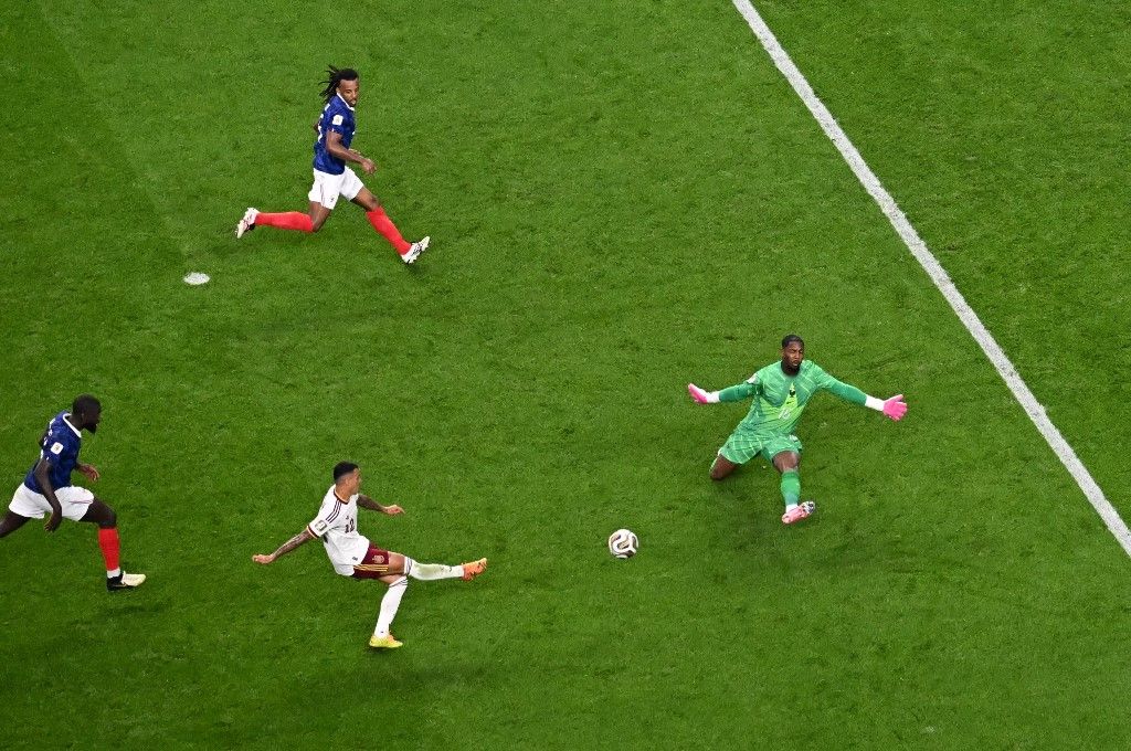 Spain's defender #12 Pedro Porro scores his team's second goal past France's goalkeeper #16 Mike Maignan during the 2026 World Cup football tournament semi-final match between France and Spain at the Dallas Stadium in Arlington on July 14, 2026. (Photo by MAURO PIMENTEL / AFP)