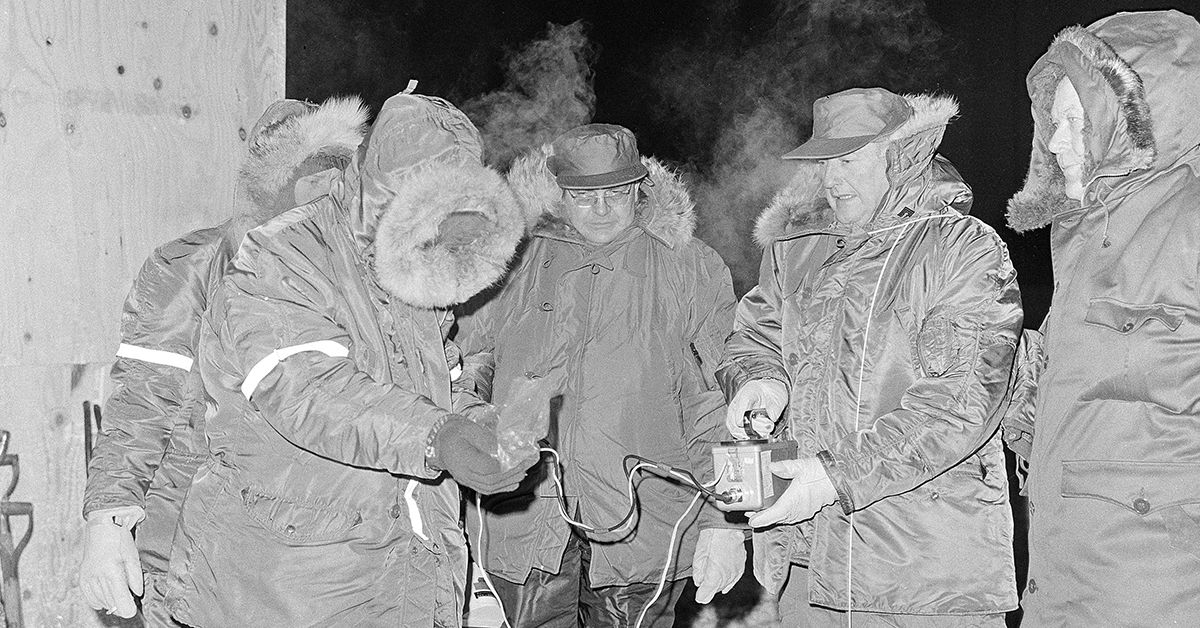 Lt. D.J. Dahlen, left, radiation specialist, and Maj. Gen. Richard O. Hunziker of the Strategic Air Command at Omaha, get a Geiger counter ready for inspection, Jan. 26, 1968, of the area where a B-52 bomber crashed with four H-bombs near Thule Air Force Base, Greenland. At right is Dr. J. Koch of the Danish Atomic Research Station. Danish scientist at center in unidentified. Bomber crashed on January 21. (AP Photo)