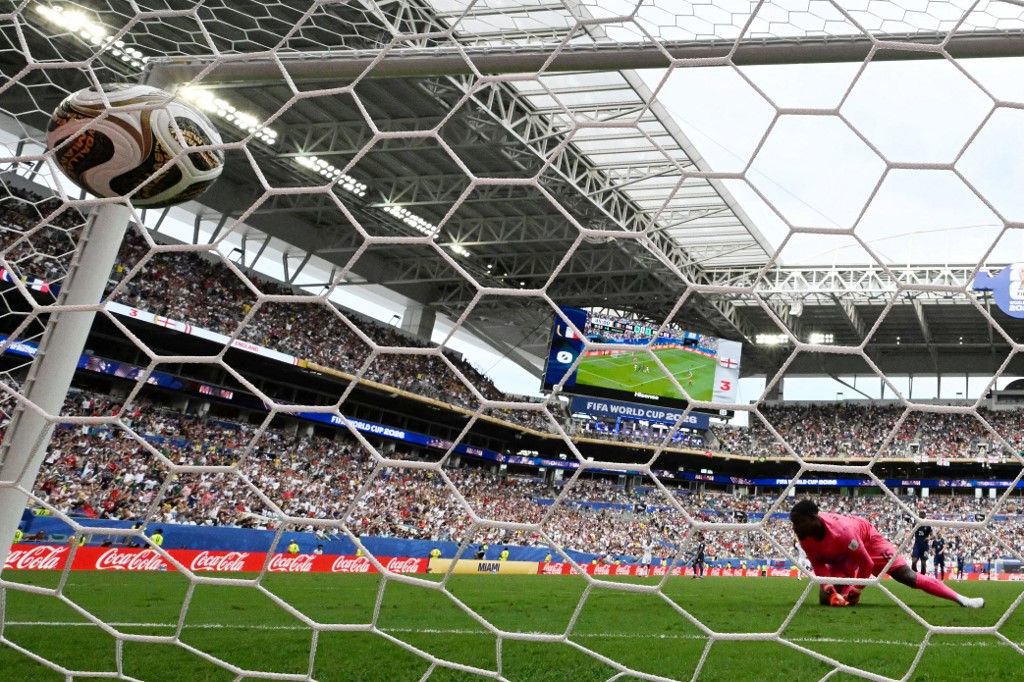 France's goalkeeper #16 Mike Maignan concedes a goal scored by England's forward #07 Bukayo Saka (out of frame) and his team's fourth goal during the 2026 World Cup football tournament third-place match between France and England at the Miami Stadium in Miami on July 18, 2026. (Photo by CHANDAN KHANNA / AFP)