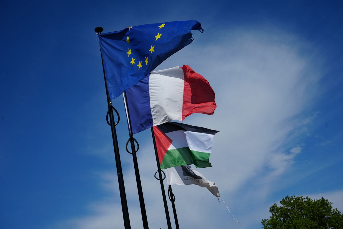 VAULX-EN-VELIN, FRANCE - JULY 11: Palestinian, French and European Union flags fly outside the town hall in Vaulx-en-Velin, an eastern suburb of Lyon, France, on July 11, 2026. The Lyon Administrative Court ordered the municipality, led by Mayor Abdelkader Lahmar of the hard-left France Unbowed (LFI) party, to remove the Palestinian flag without delay, ruling that its display breached the neutrality of public services. The flag was raised on July 4 during the municipal festival âResonance Palestine,â? and the court, acting on an emergency application filed by Rhone Prefect Etienne Guyot, suspended the mayorâs decision and imposed a fine of 100 euros ($117) for each day of delay after notification of the order. Mathieu Prudhomme / Anadolu (Photo by Mathieu Prudhomme / Anadolu via AFP)