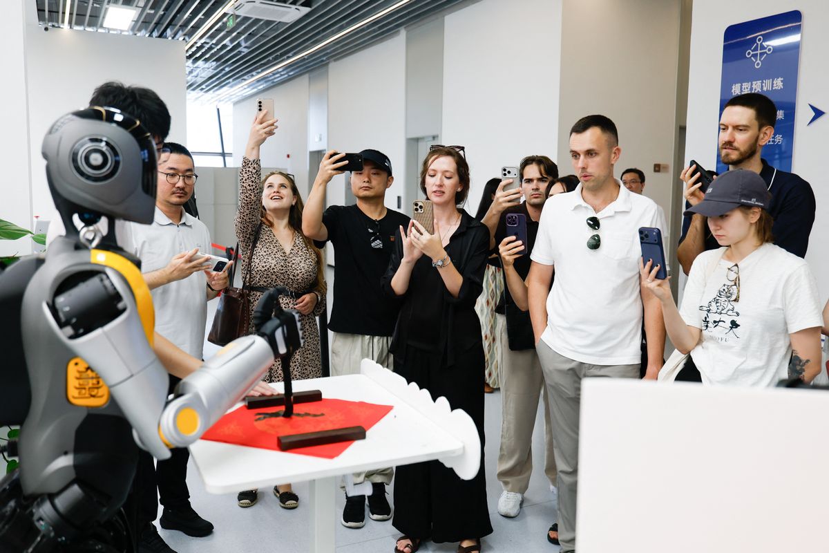 (260827) -- BEIJING, Aug. 27, 2026 (Xinhua) -- Members of a joint China-Russia media delegation watch a performance at a humanoid robot innovation center in Wuhan, central China's Hubei Province, Aug. 25, 2026.
The delegation visited Hangzhou, Wuhan and Shenzhen in recent days to learn about the AI robotics industry. (Xinhua/Wu Zhizun) (Photo by Wu Zhizun / Xinhua via AFP)