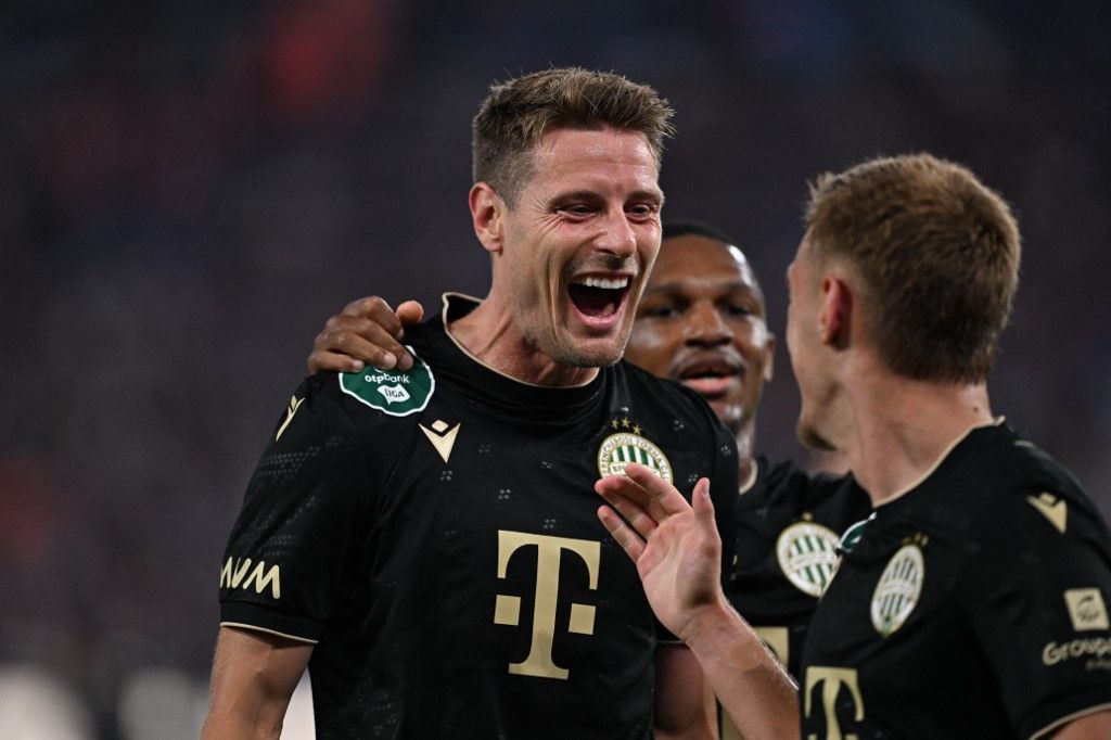 TRABZON, TURKIYE - AUGUST 20: Kristoffer Zachariassen (L) of Ferencvaros celebrates after scoring a goal during the first leg of the UEFA Europa League play-off round between Trabzonspor and Ferencvaros at Papara Park in Trabzon, Turkiye, on August 20, 2026. Hakan Burak Altunoz / Anadolu (Photo by Hakan Burak Altunoz / Anadolu via AFP)