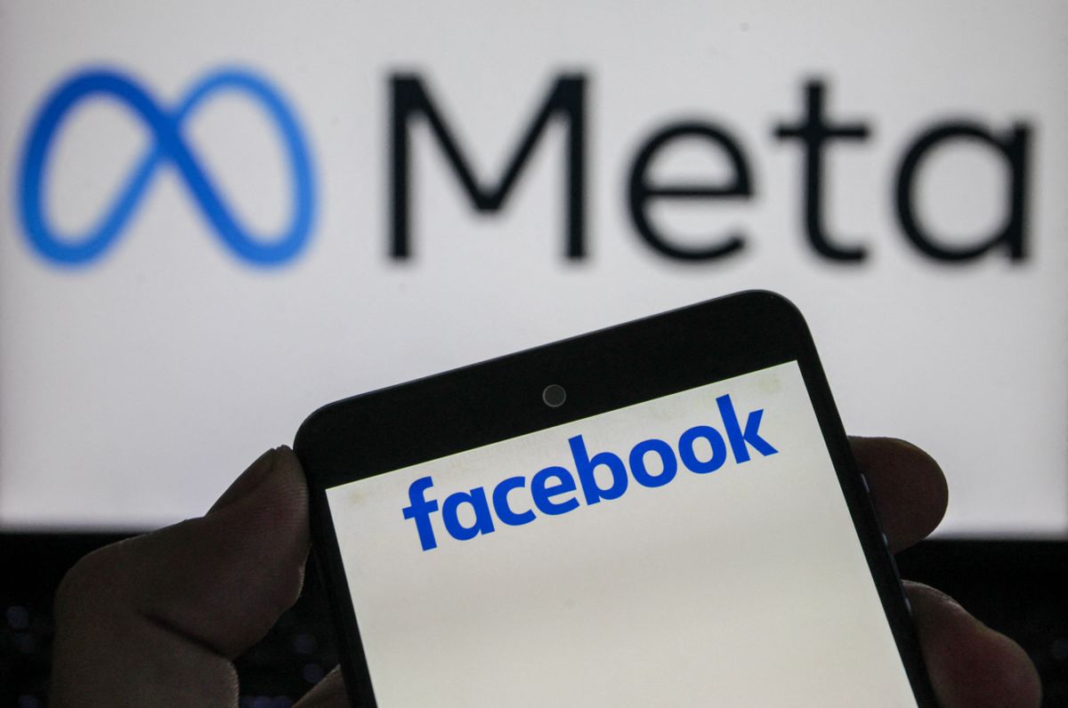 This photo illustration shows the Facebook logo displayed in the foreground, with the Meta logo in the background, in Tunis,Tunisia, on August 19,2026. (Photo by Imen Ben Youssef / Hans Lucas via AFP)