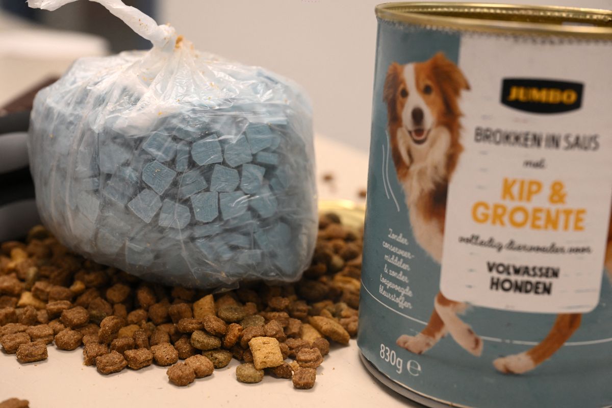 This photograph shows a bag of ecstasy pills (MDMA) hidden in a dog food can seized by customs officers at Brussels Airport (Zaventem), during a press conference intended to present an overview of drug seizures in 2025, in Machelen on December 16, 2025. (Photo by Nicolas TUCAT / AFP)