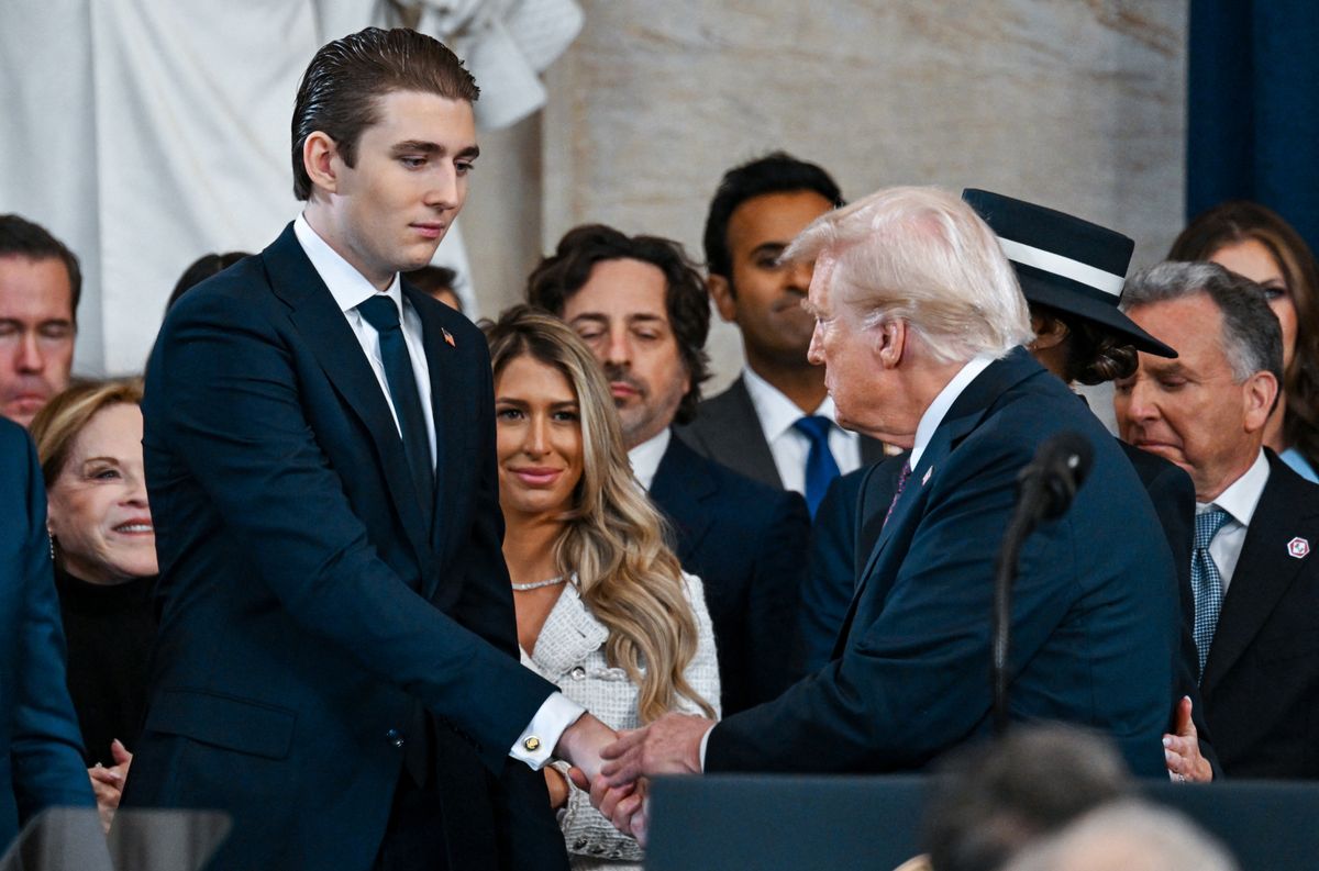Barron Trump shakes hands with President Donald Trump after the inauguration of Donald Trump as the 47th president of the United States takes place inside the Capitol Rotunda of the U.S. Capitol building in Washington, D.C., Monday, January 20, 2025. It is the 60th U.S. presidential inauguration and the second non-consecutive inauguration of Trump as U.S. president. (Photo by Kenny Holston/The New York Times / AFP)