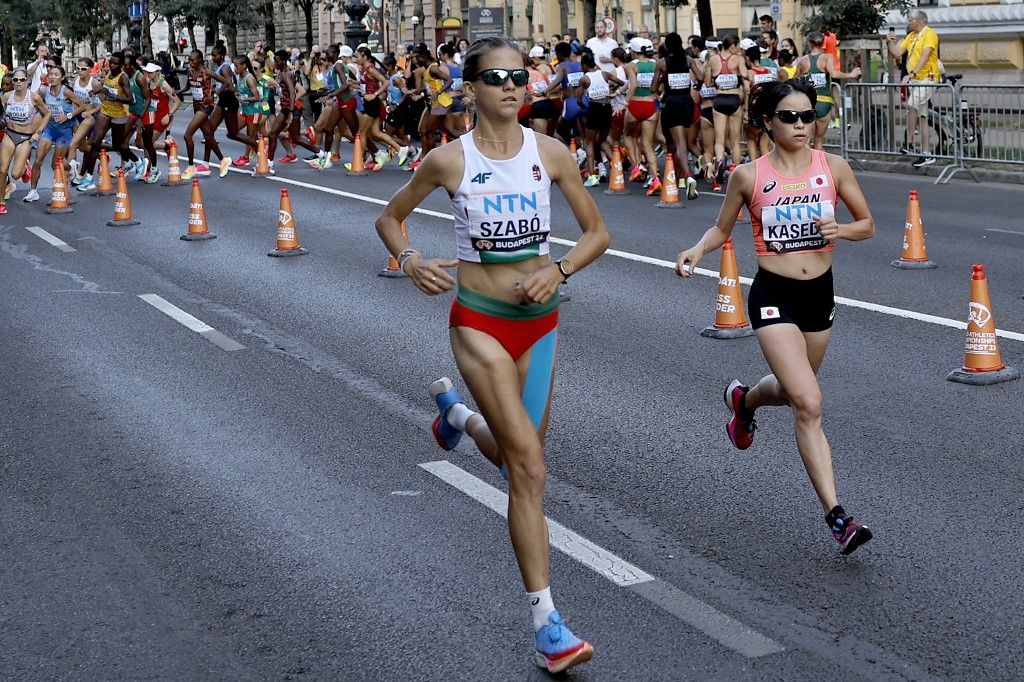 Hungary's Nora Szabo and Japan's Rika Kaseda compete in the women's marathon final during the World Athletics Championships in Budapest on August 26, 2023. (Photo by ROBERT GHEMENT / POOL / AFP)