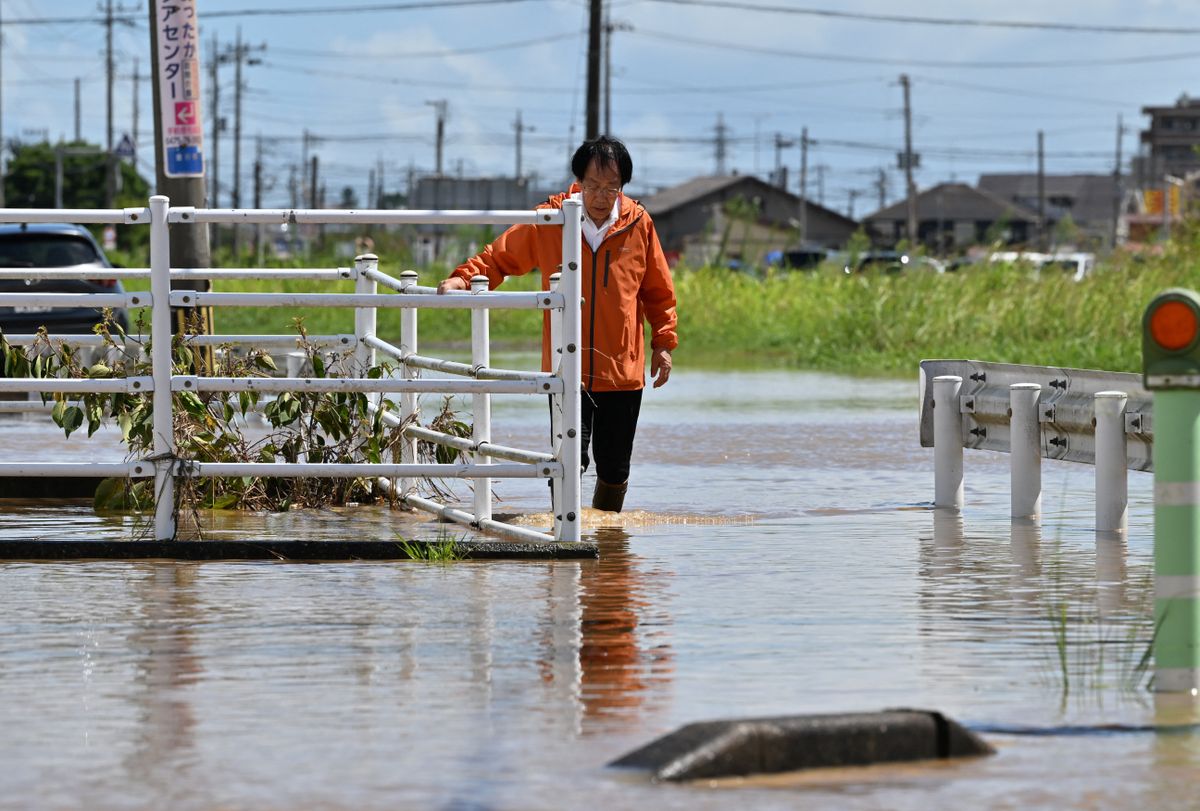 A photo shows widespread flooding around JR Oami Station following torrential rain in Oamishirasato City, Chiba Prefecture, Japan, on August 14, 2026. A linear rainband brought torrential rain to Chiba Prefecture, prompting the Japan Meteorological Agency to issue its highest-level emergency warnings for heavy rain and landslides in Chiba City and other areas from the night of August 13 into early August 14. ( The Yomiuri Shimbun ) (Photo by Keita Iijima / The Yomiuri Shimbun via AFP)