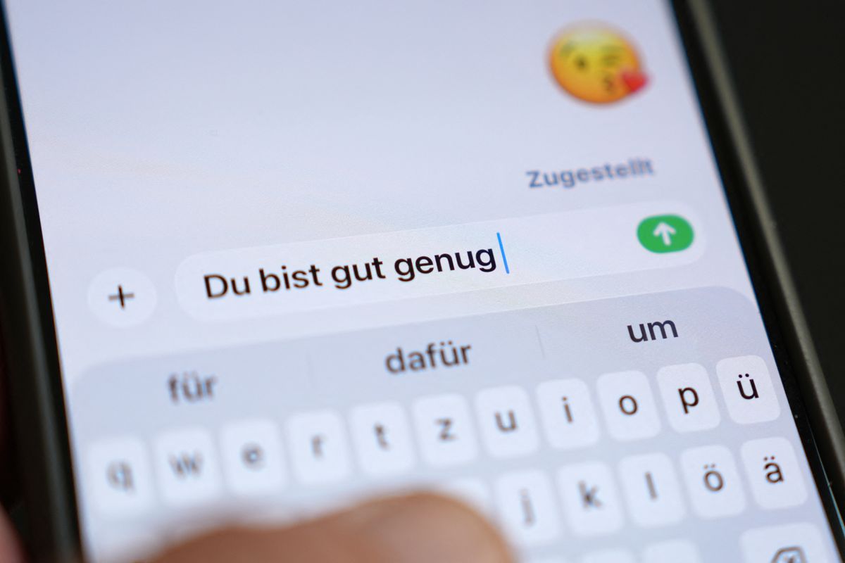 ILLUSTRATION - 27 July 2026, Hamburg: The phrase Youre good enough appears on a smartphone screen in a chat history. The top 10 finalists for the 2026 Youth Word of the Year, to be announced in October, have been selected. Photo: Marcus Brandt/dpa (Photo by MARCUS BRANDT / dpa Picture-Alliance via AFP)