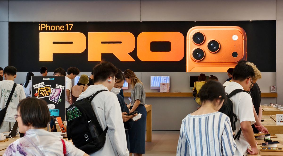 A consumer experiences products such as Apple iPhone 17 Pro at the Apple Smart Products Flagship Store in Shanghai, China on August 27, 2026. (Photo by XY / CFOTO via AFP)