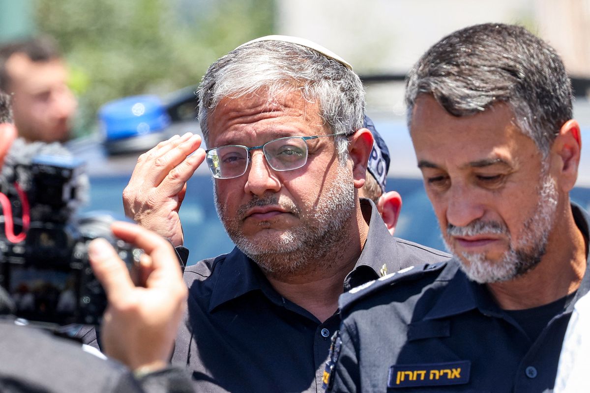 Israel's far-right national security minister Itamar Ben Gvir (C) arrives at the site of a suspected shooting attack in the town of Tzur Yitzhak in central Israel close to the occupied West Bank on June 7, 2026. One person was killed and four others wounded in multiple suspected shooting attacks in Israel on June 7, rescuers and the army said. (Photo by Jack GUEZ / AFP)