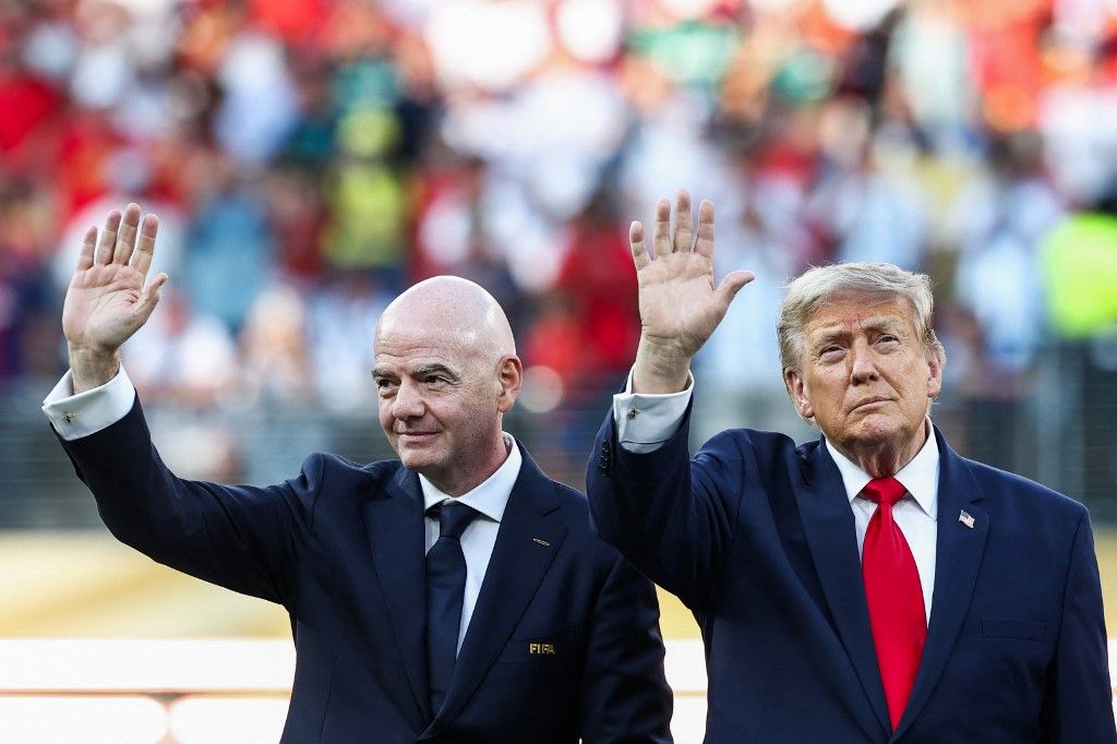 US President Donald Trump (R) and FIFA President Gianni Infantino (L) wave during the award ceremony of the 2026 World Cup football tournament final match between Spain and Argentina at the New York/New Jersey Stadium in East Rutherford on July 19, 2026.  (Photo by FRANCK FIFE / AFP)