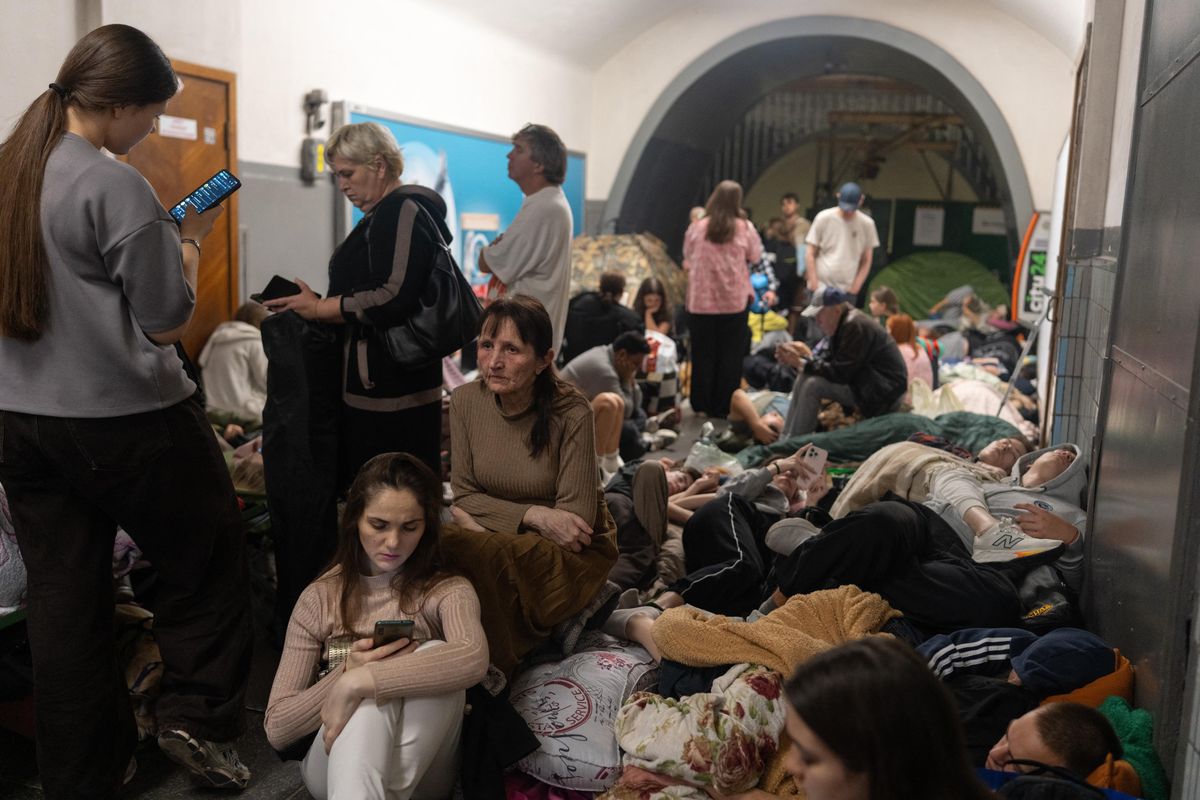 People take shelter at a metro station during Russian missile strike on Kyiv, early on July 30, 2026, amid the Russian invasion of Ukraine. Russian strikes on Kyiv killed at least one person, authorities said on July 30, after Ukrainian President Volodymyr Zelensky warned of Moscow launching another massive attack overnight. (Photo by OLEKSII FILIPPOV / AFP)