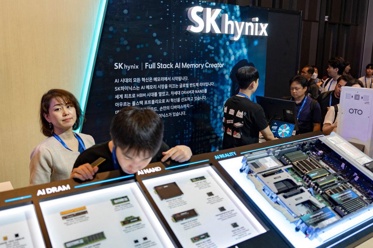 An attendee inspects exploded diagrams and interactive hardware exhibits of server motherboards and system components at the SK Hynix booth during the Dell Technologies Forum 2026 at COEX in Seoul, South Korea, on August 25, 2026. (Photo by Chris Jung/NurPhoto) (Photo by Chris Jung / NurPhoto via AFP)
