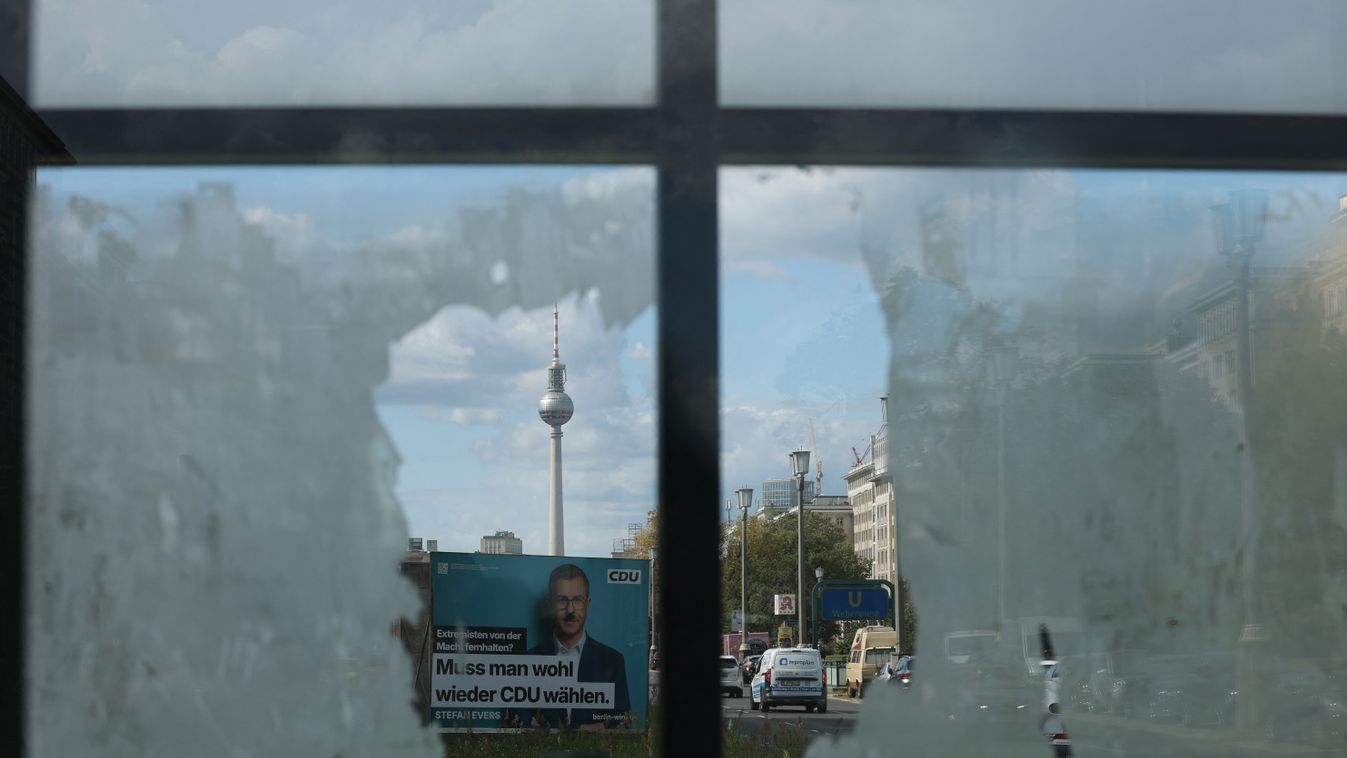 A vandalized / defaced election campaign poster featuring top candidate of the conservative Christian Democratic Union (CDU) party Stefan Evers  for the upcoming Berlin state elections is pictured with the TV-tower landmark in the background, in Berlin on