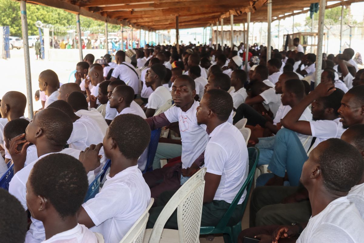Former Boko Haram members gather during a reintegration ceremony at Hajj camp in Maiduguri on June 12, 2026. The Borno State government has organised a de-radicalisation and rehabilitation programme for 720 former Boko Haram fighters ahead of their reintegration into society.
The initiative is part of the governments non-military efforts to combat insurgency in the region. (Photo by Audu MARTE / AFP)