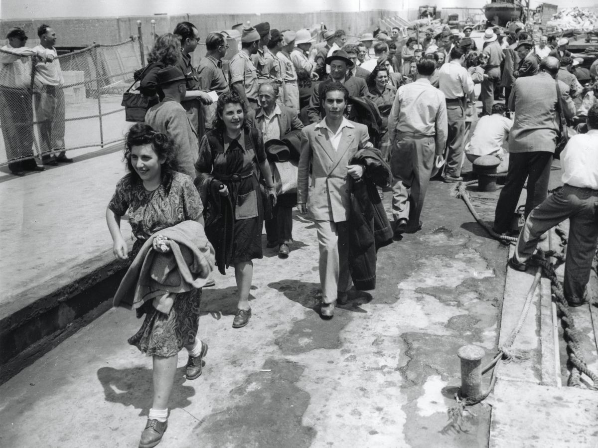 Jewish refugees arrive at the port of Tel Aviv, Isreal, May 22, 1948. These are the first of over a hundred thousand refugees due to be brought into the country by the Jewish agency during the first year of the Jewish state. (Photo by PhotoQuest/Getty Images)