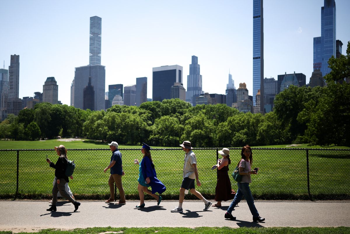 People walk in Central Park in the Manhattan borough of New York City on May 20, 2026. (Photo by CHARLY TRIBALLEAU / AFP)