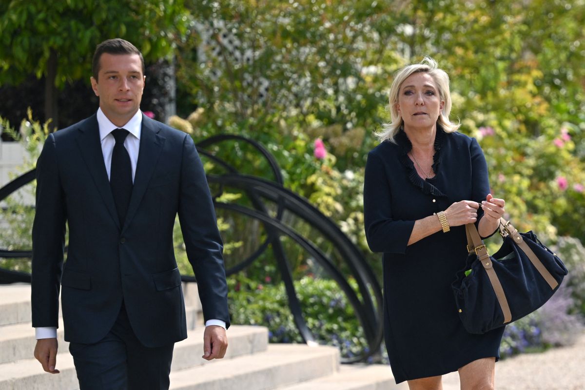 President of the French far-right party Rassemblement National (RN) and MEP Jordan Bardella (L) and French Member of Parliament and French far-right Rassemblement National (National Rally) RN party's leader Marine Le Pen (R) leave after their meeting with French President at the Elysee presidential palace in Paris, on August 26, 2024. (Photo by Bertrand GUAY / AFP)