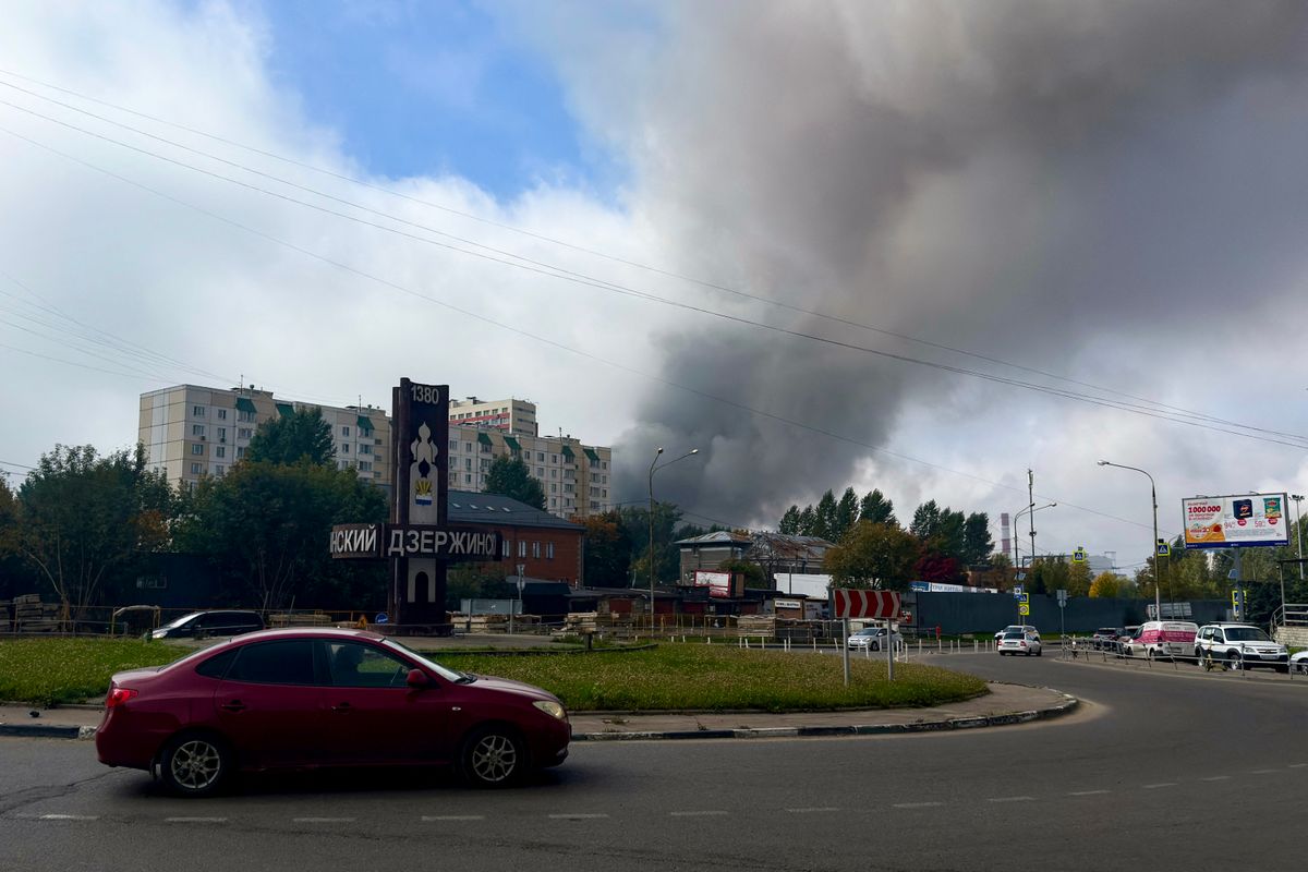 Smoke rises from the area of the Russian oil producer Gazprom Neft's Moscow oil refinery as seen from Dzerzhinsky in the Moscow region on September 20, 2026. Hundreds of drones targeting Moscow and its surrounding region killed at least two people and damaged a major refinery on the final day of the country's parliamentary elections, the authorities said on September 20, 2026. (Photo by AFP)