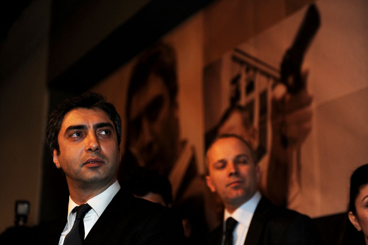 TO GO WITH AFP STORY BY NICOLAS CHEVIRON IN FRENCH
Actor of the movie "Valley of the Wolves - Palestine" Necati Sasmaz(L) speaks to media during their a presentation in Istanbul, on January 27, 2011. A Turkish action movie based on the deadly Israeli raid on a Gaza-bound Turkish aid ship opened in cinemas across Turkey on Friday. The movie "Valley of the Wolves - Palestine" is about a Turkish undercover agent who hunts down Israeli commanders responsible for the killing of nine activists who died in the real-life May 31 attack on a ship that tried to bust through the blockade of Gaza as part of an international flotilla. AFP PHOTO/BULENTKILIC (Photo by BULENT KILIC / AFP)
