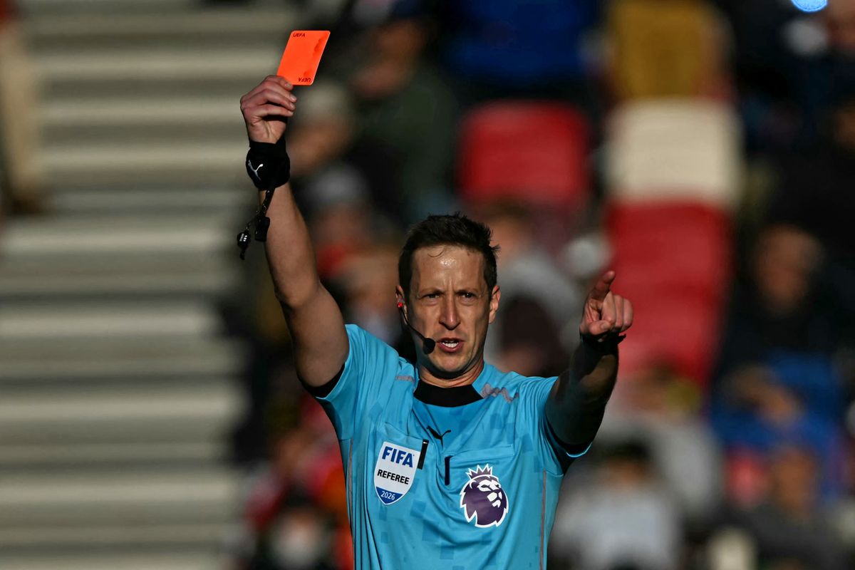 English referee John Brooks shows a red card to Brentford's Ukrainian midfielder #06 Yehor Yarmolyuk during the English Premier League football match between Brentford and Liverpool at the Gtech Community Stadium in London on October 17, 2026. (Photo by Glyn KIRK / AFP) / RESTRICTED TO EDITORIAL USE. No use with unauthorized audio, video, data, fixture lists, club/league logos or 'live' services. Online in-match use limited to 120 images. An additional 40 images may be used in extra time. No video emulation. Social media in-match use limited to 120 images. An additional 40 images may be used in extra time. No use in betting publications, games or single club/league/player publications. / 
