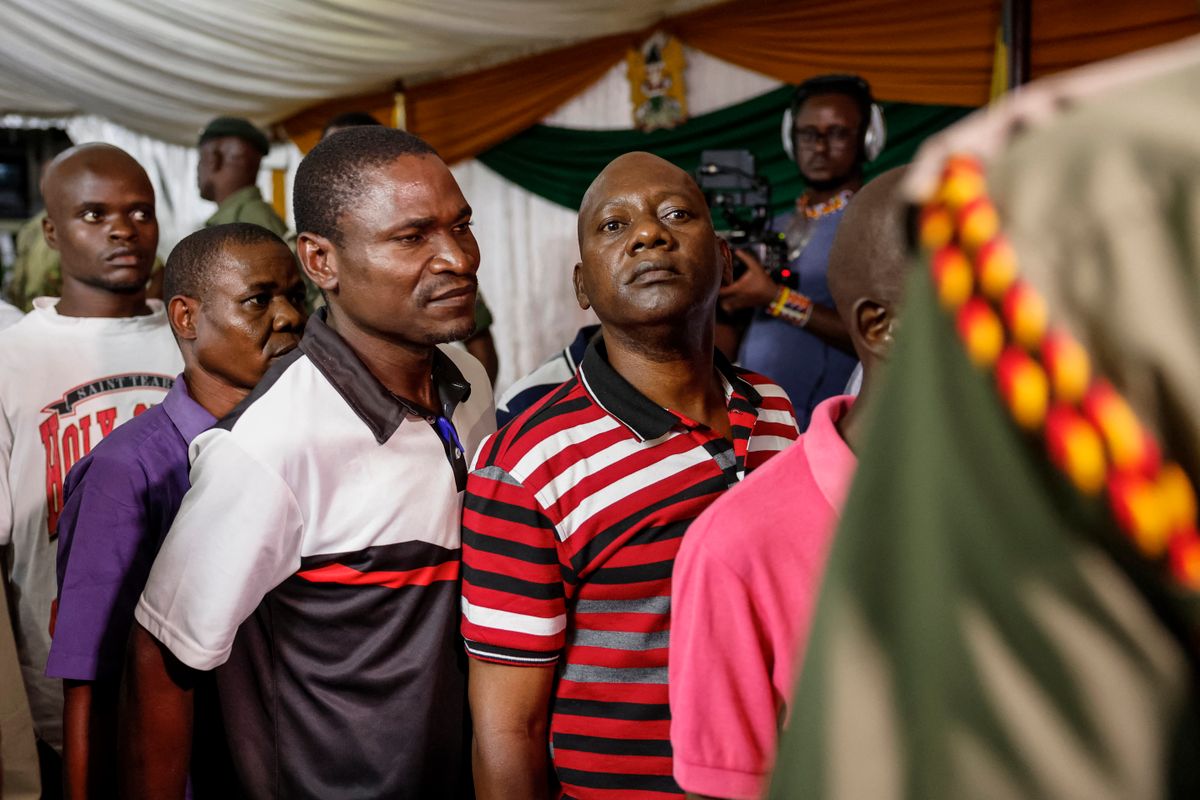 Self-proclaimed pastor Paul Mackenzie (4th L) and his co-accused are escorted following the judgement during their court appearance at the Mombasa Law Courts in Mombasa on October 19, 2026. A self-proclaimed Kenyan preacher and his associates were on October 19 found guilty of murdering 191 people, mostly children, in an infamous starvation cult. Hundreds of bodies have been discovered since 2023 at the cult base inland from the Kenyan beach resort of Malindi, in what became known as the "Shakahola Forest Massacre". (Photo by SIMON MAINA / AFP)